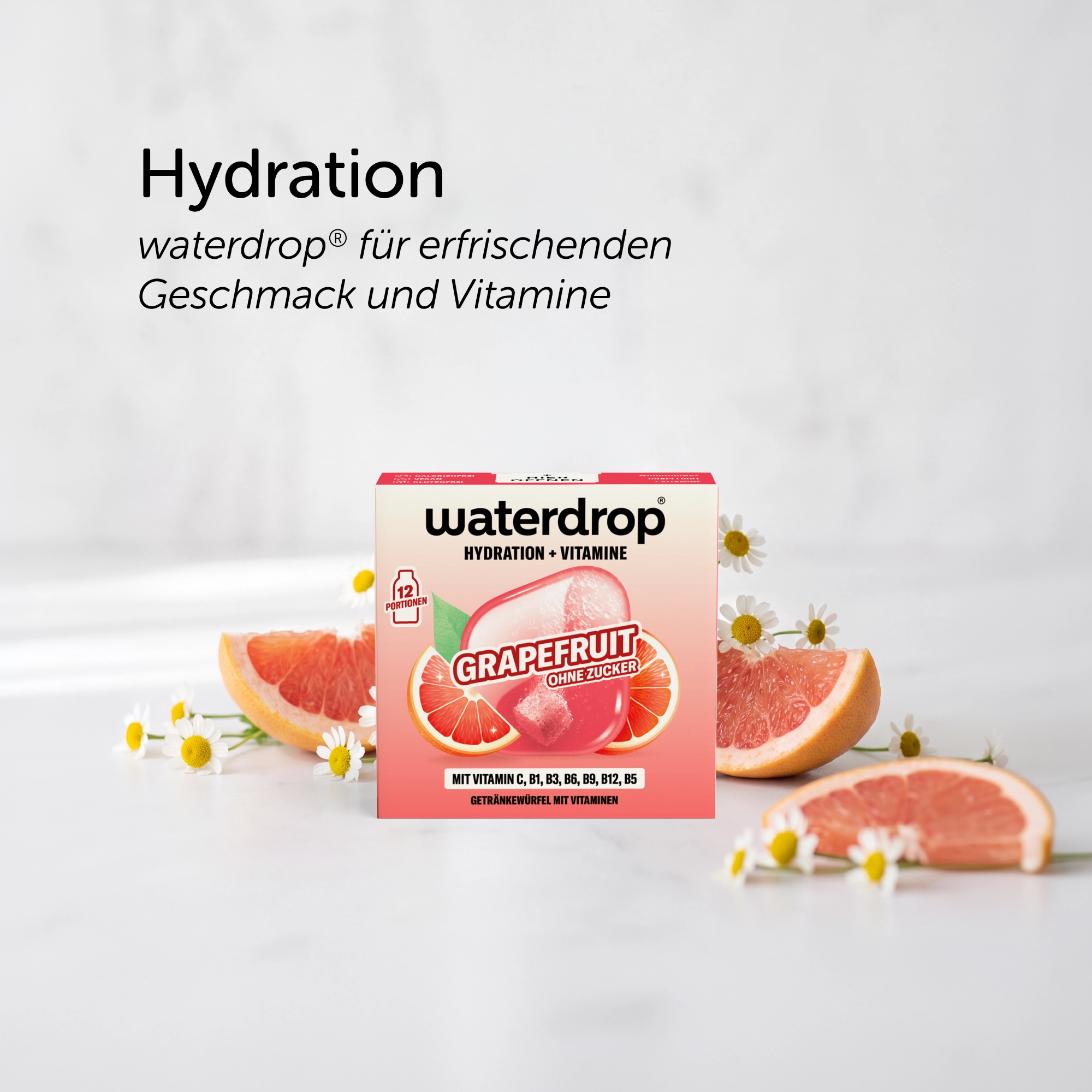 PANACEO Detox Summer Bundle mit waterdrop Hydration Grapefruit, umgeben von Grapefruitstücken und weißen Blüten, sommerliche Produktinszenierung für erfrischenden Geschmack und Vitamine.