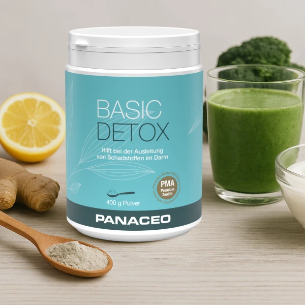 Warum Darm-Detox so wichtig ist Darmentgiftung: Abbildung eines BASIC DETOX Produkts mit frischen Zutaten wie Zitrone, Ingwer, Brokkoli und einem grünen Smoothie